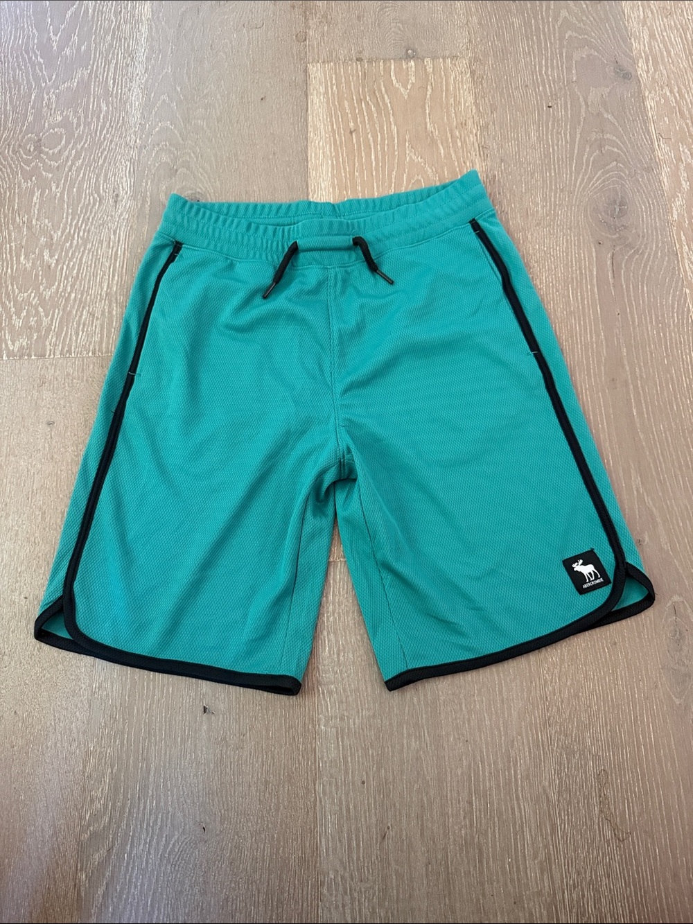 abercrombie kids teal athletic shorts with black logo